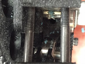 Figure 6. Degraded Filament Clogging Gears in Print head.
